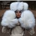 Woman wearing Arctic Marble Fox teddy-style fur hat and full mittens, showcasing white and silver natural fur texture